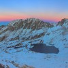 Sunset over Podragu lake and Tarata north ridge in Fagaras mountains